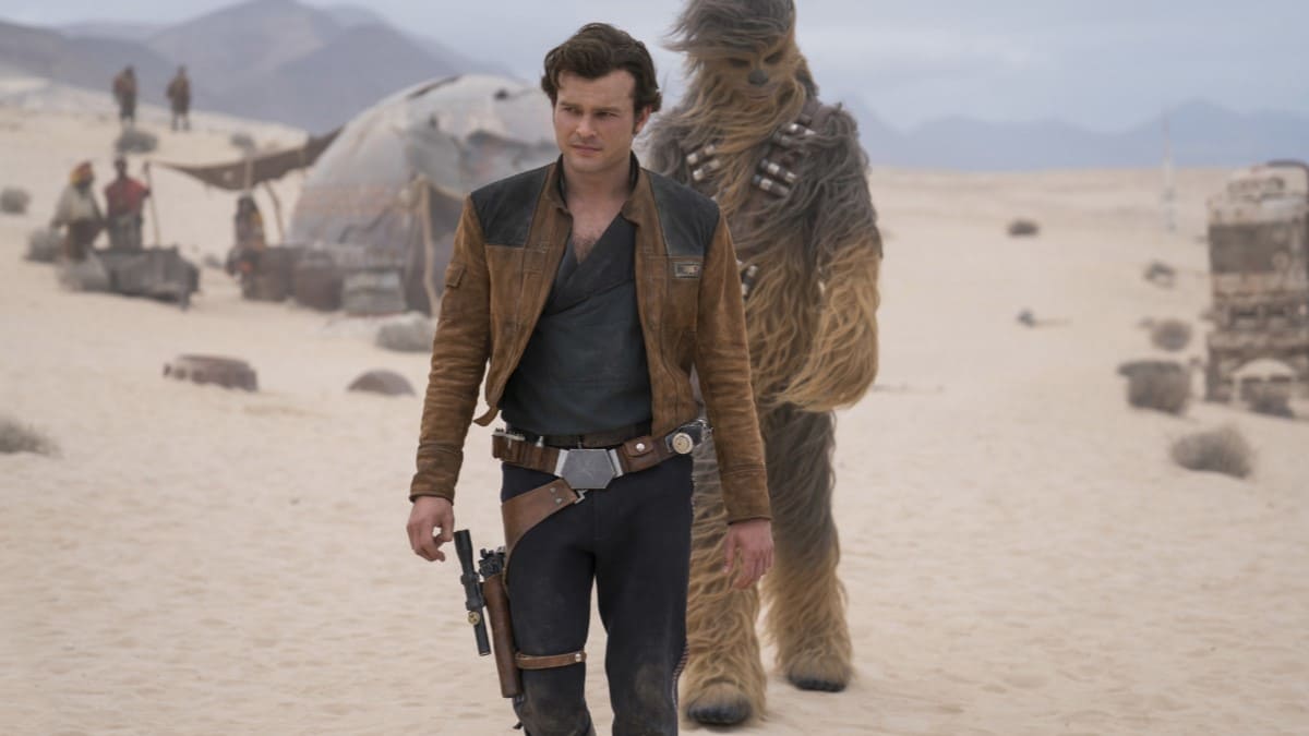 Han Solo walks through a sandy planet in Solo: A Star Wars Story