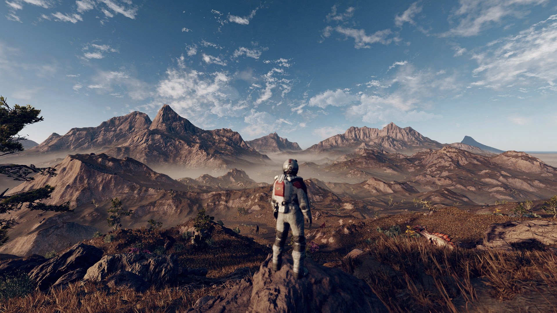 An image from the video game 'Starfield,' featuring a person in a space suit looking out over an earthen terrain
