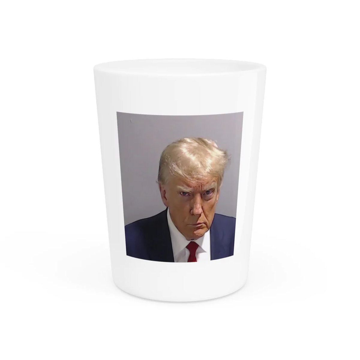 Donald Trump's face on a shot glass