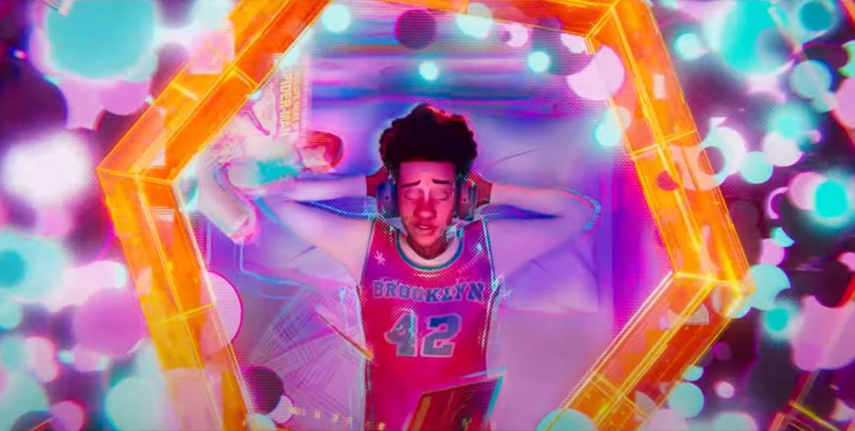 Miles listening to music as a portal opens up. Image: Sony Pictures.