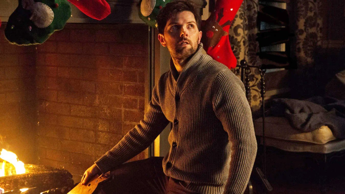 Adam Scott in a cozy sweater in Krampus