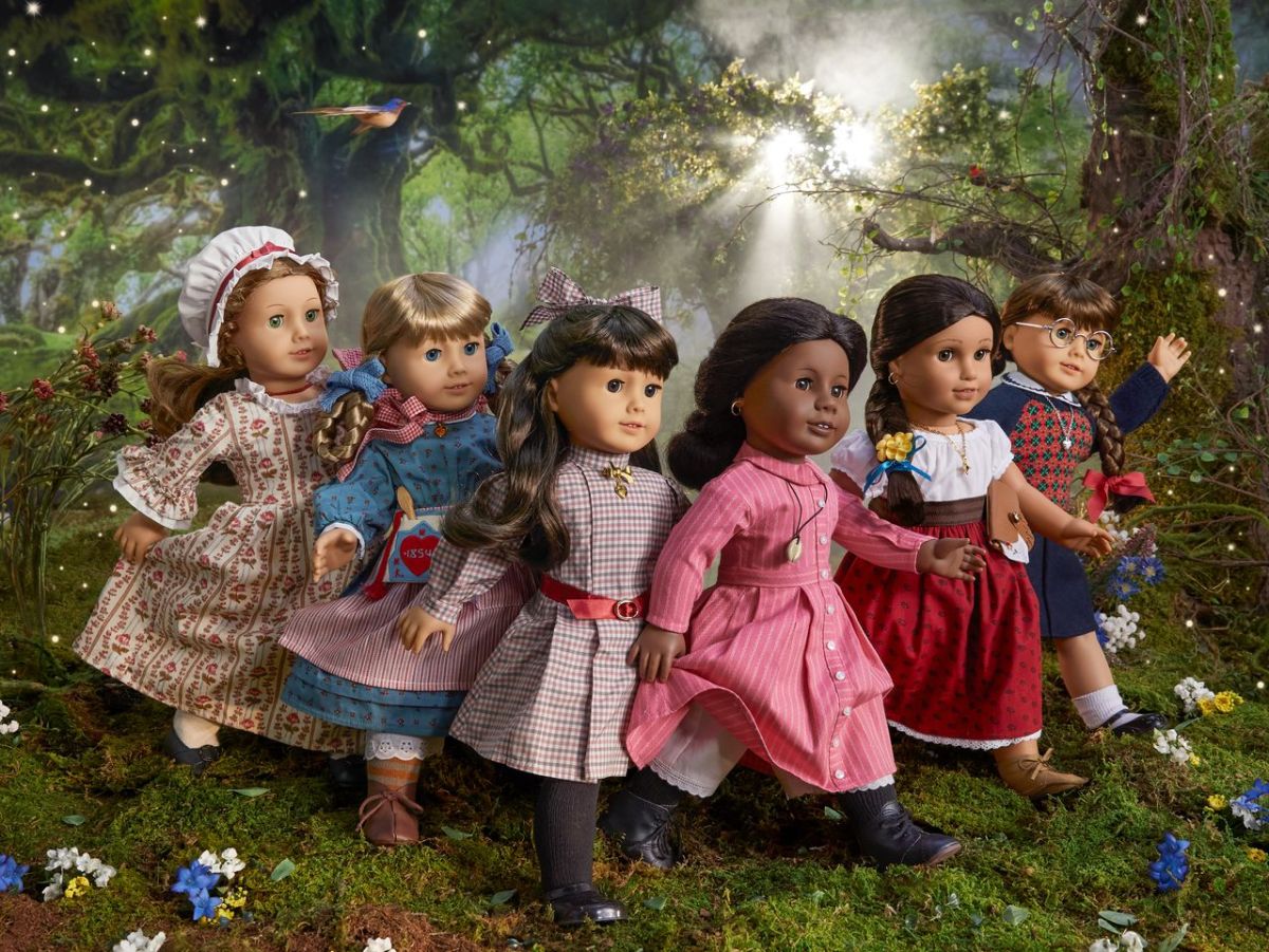 a gaggle of american girl dolls
