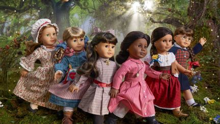 a gaggle of american girl dolls