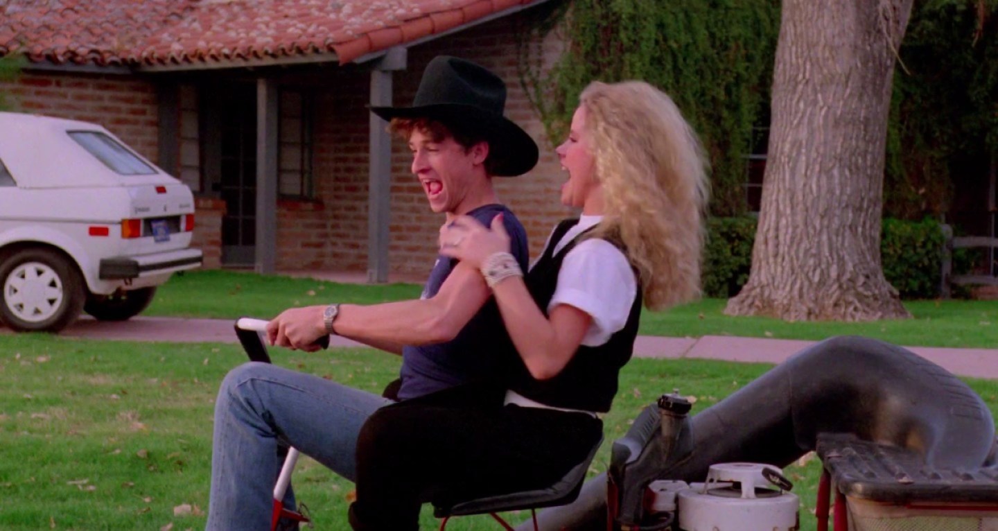 Patrick Dempsey and Amanda Peterson on a lawn mower in Can't Buy Me Love