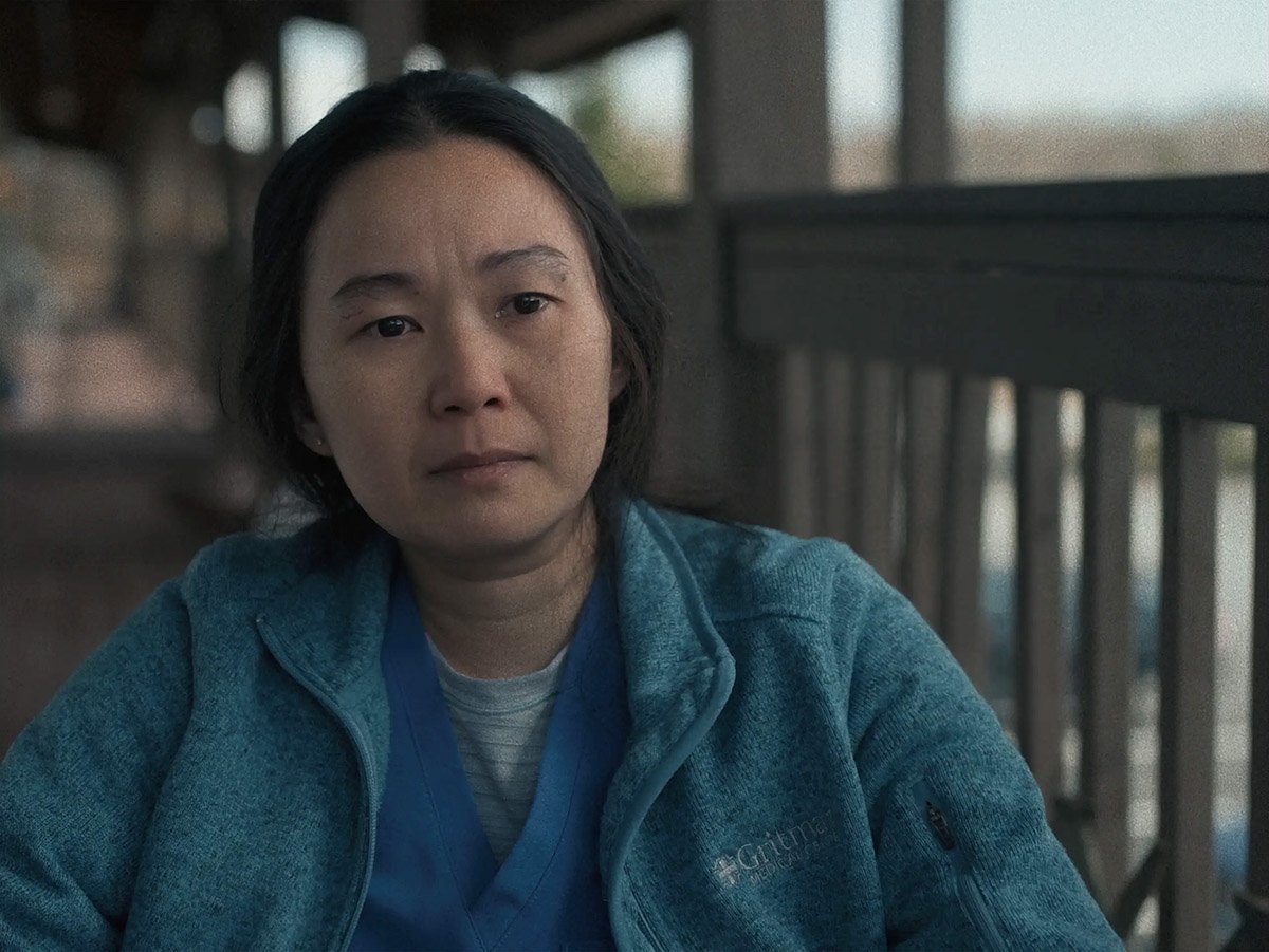 Hong Chau sitting on a porch in the Whale