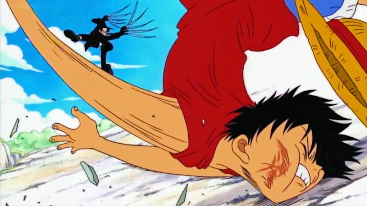 Luffy takes a brutal punch to the face from Captain Kuro in "One Piece" (Toei)