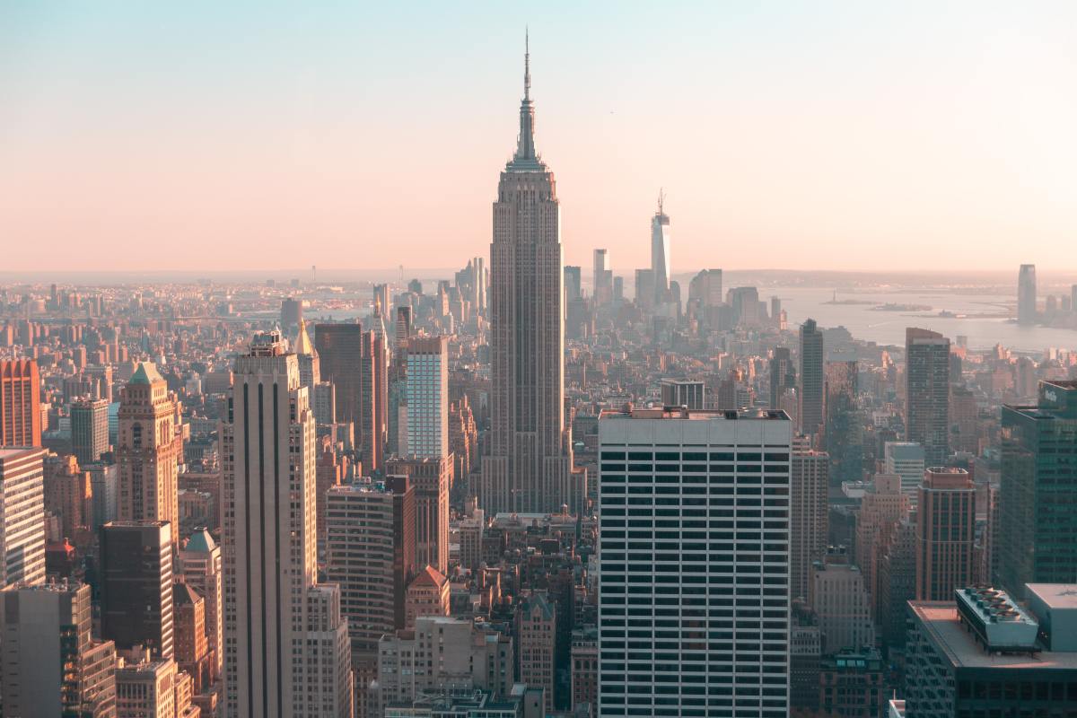 Photo of the Empire State Building, surrounded by the New York City skyline.