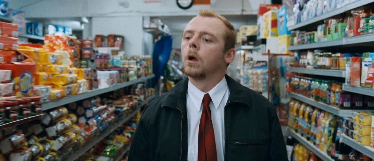 Simon Pegg walking through a store in Shaun of the Dead