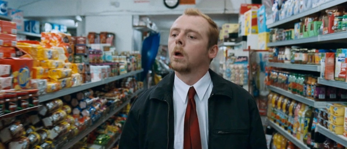 Simon Pegg walking through a store in Shaun of the Dead