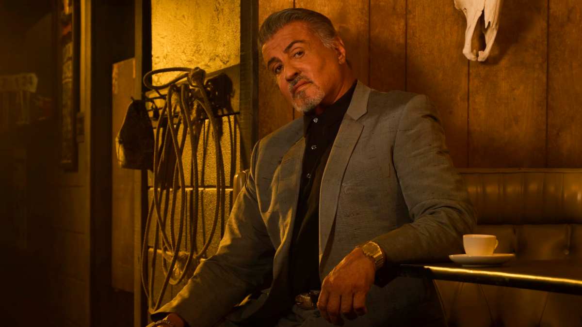 Dwight Manfredi sits in a cowboy saloon.