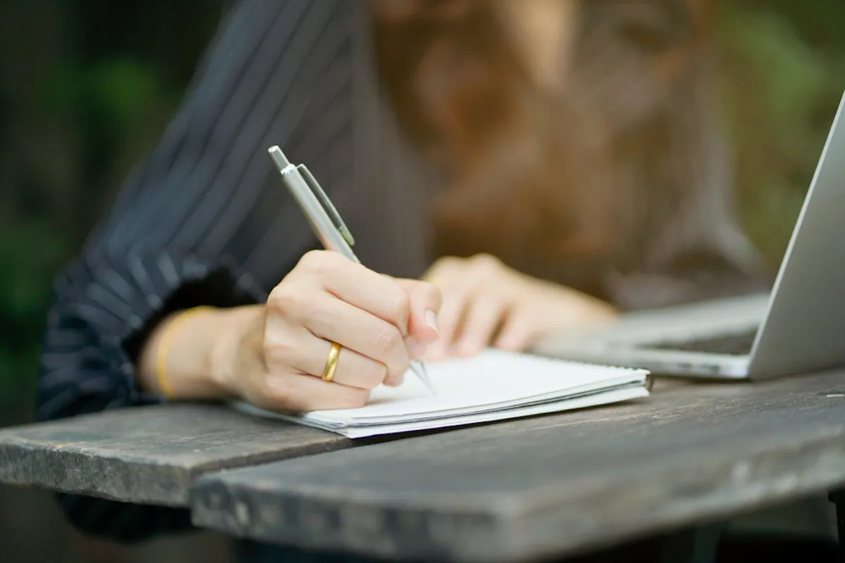 A woman writing.