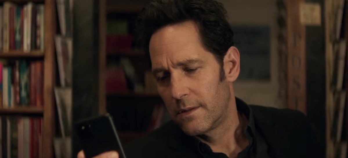 Scott Lang looks at his cell phone.