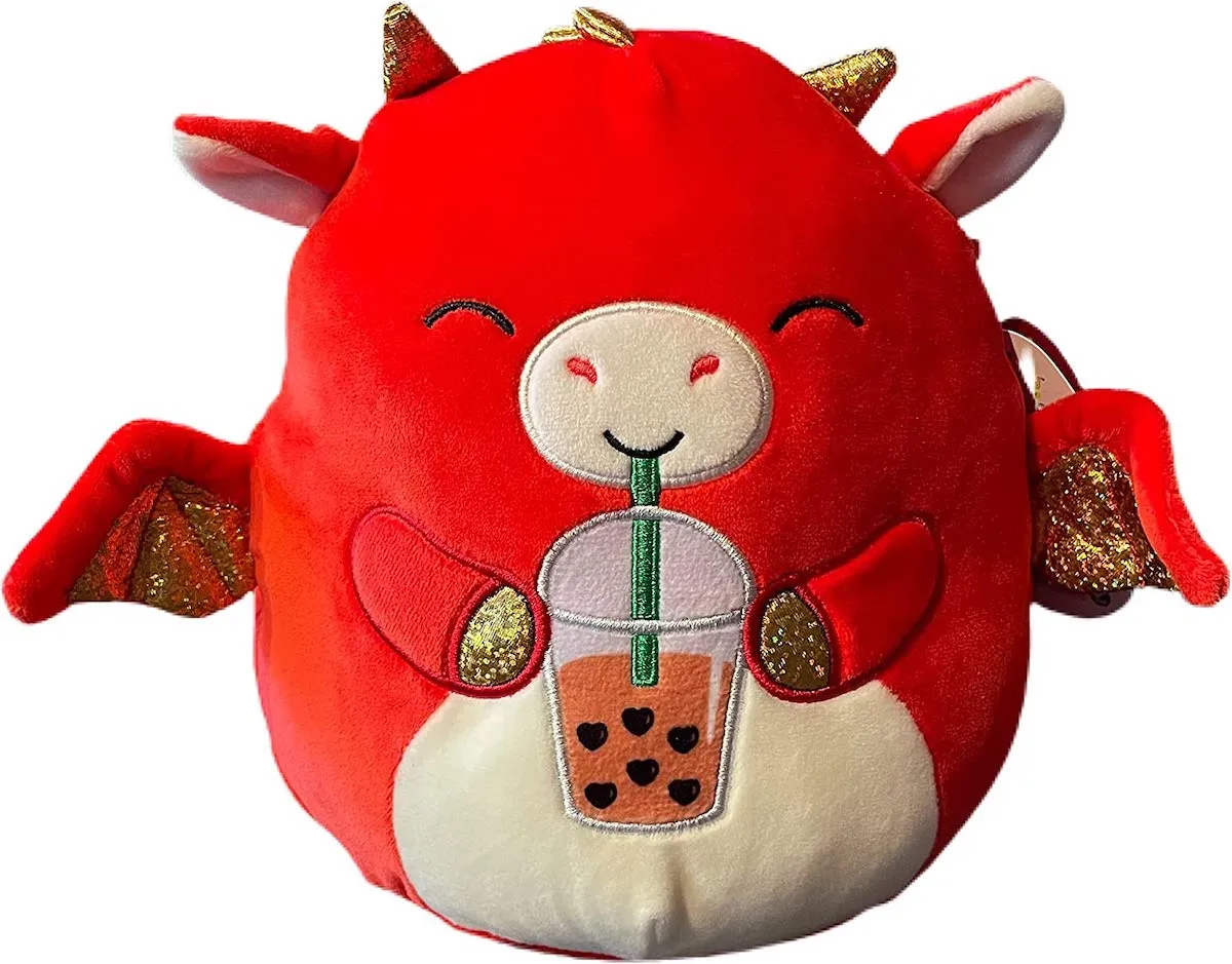 A red and gold dragon Squishmallow drinking boba tea