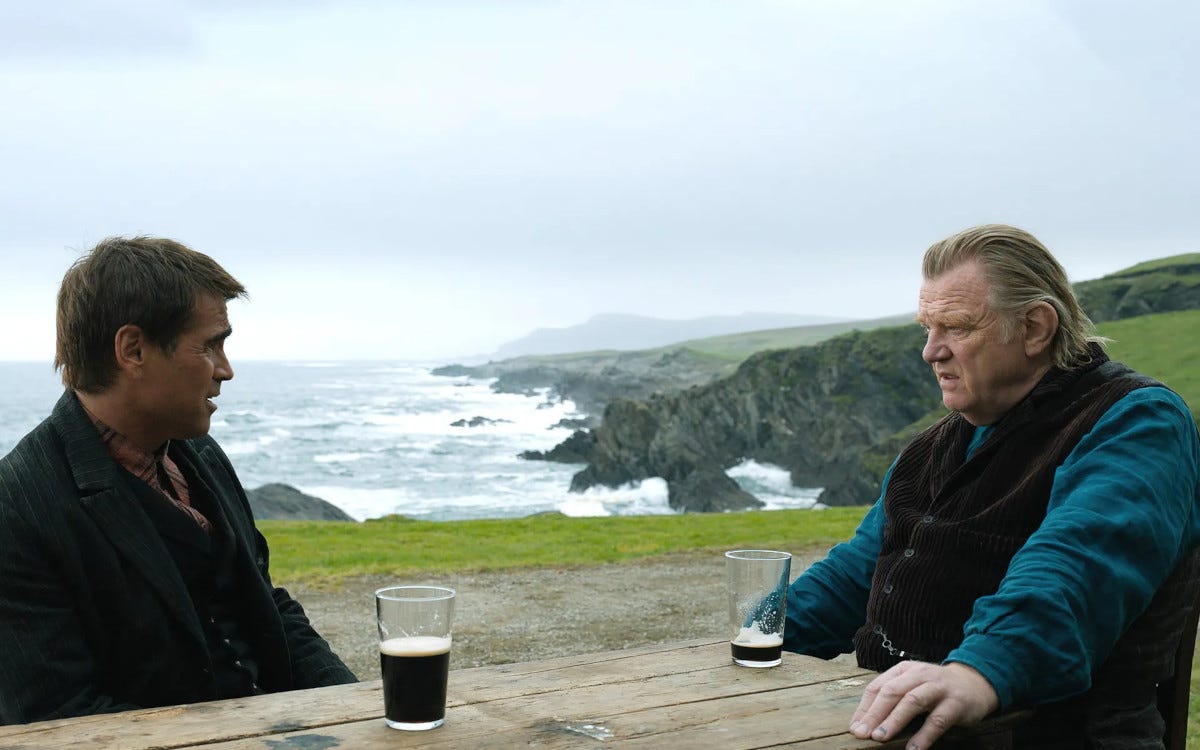 Padraic (Colin Farrell) and Colm (Brendan Gleeson) look at each other across a bench in 'The Banshees of Inisherin'