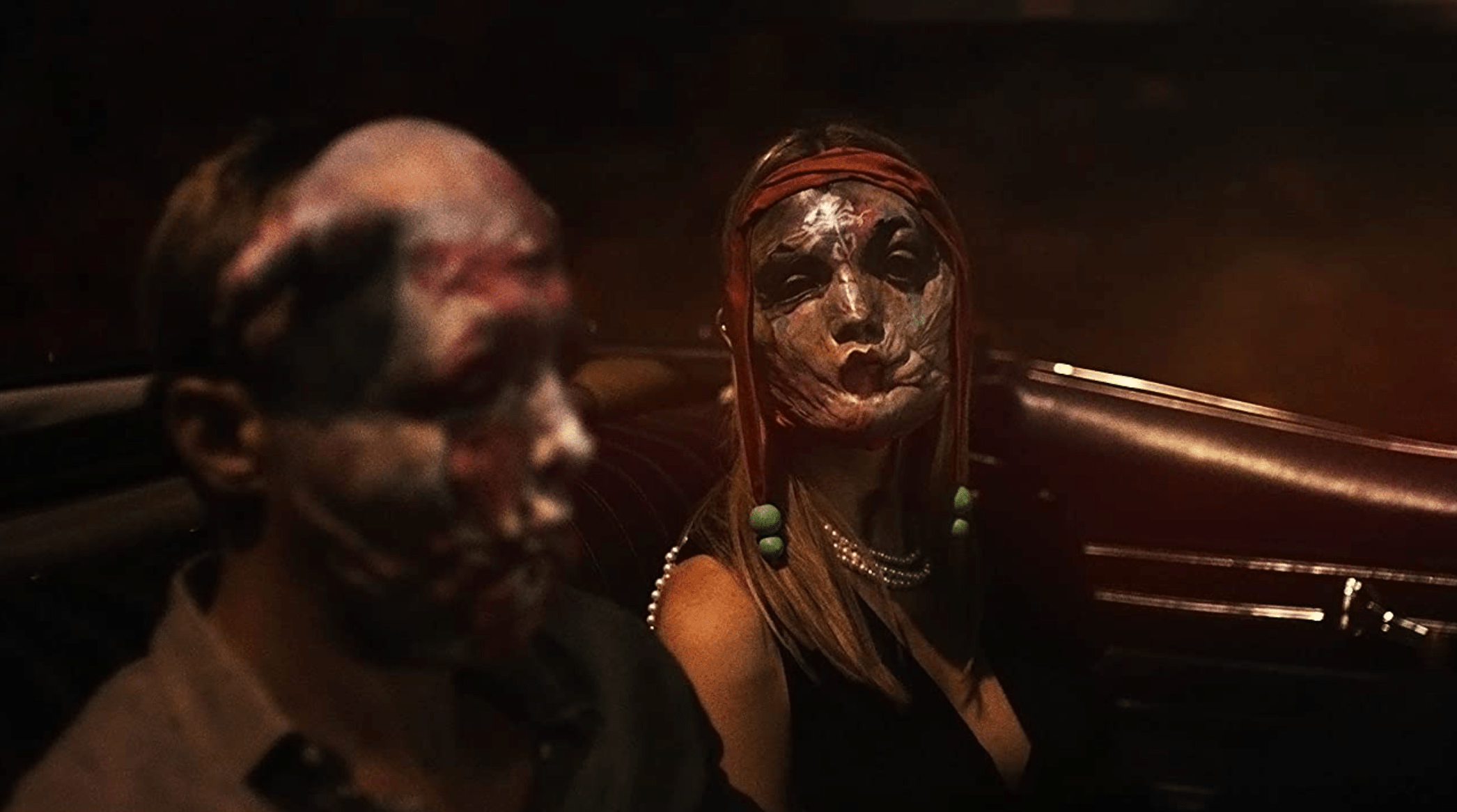 Alexander Skarsgard and Mia Goth in creepy flesh masks
