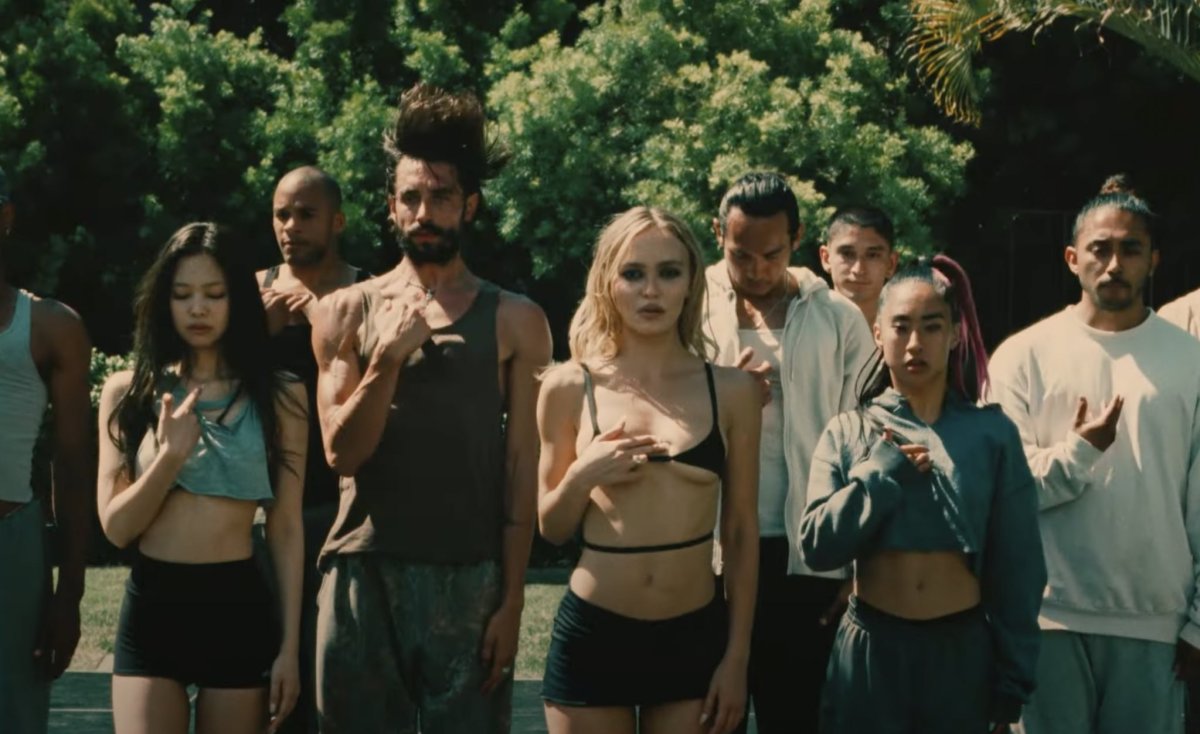 a group of dancers and singers standing outside from the series, The Idol