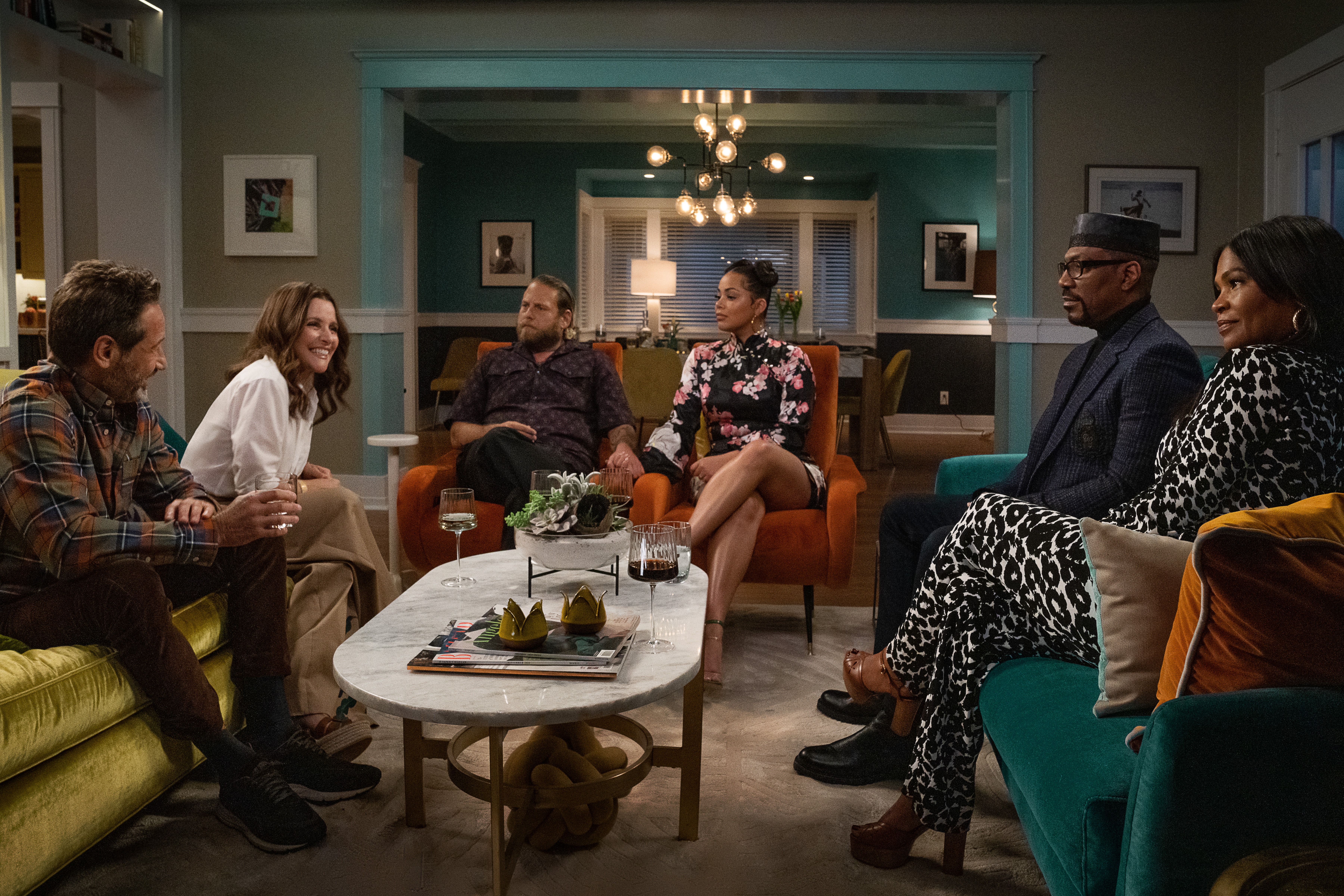 A family is gathered in a living room to meet their daughter's new boyfriend in a scene from 'You People,' starring Jonah Hill