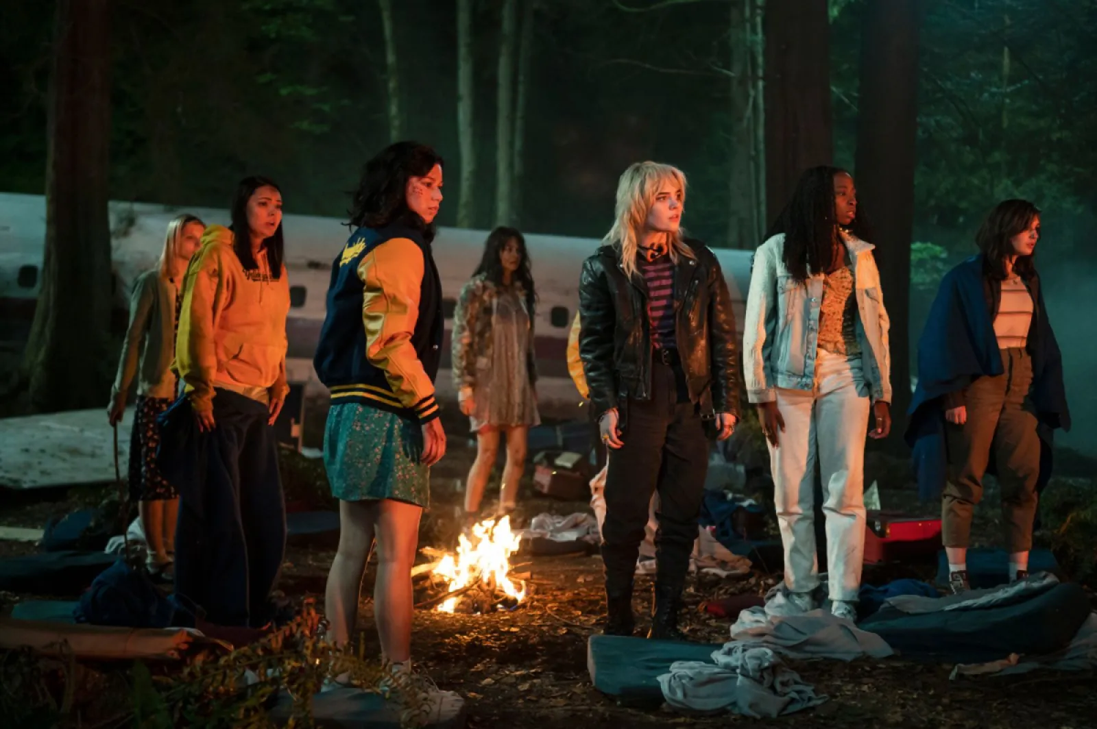 Survivors of the women's high school soccer team, the Yellowjackets, outside of their tragic plane crash scene