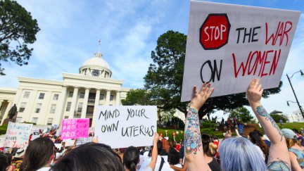 A crowd of abortion advocates protest outside the Alabama statehouse.