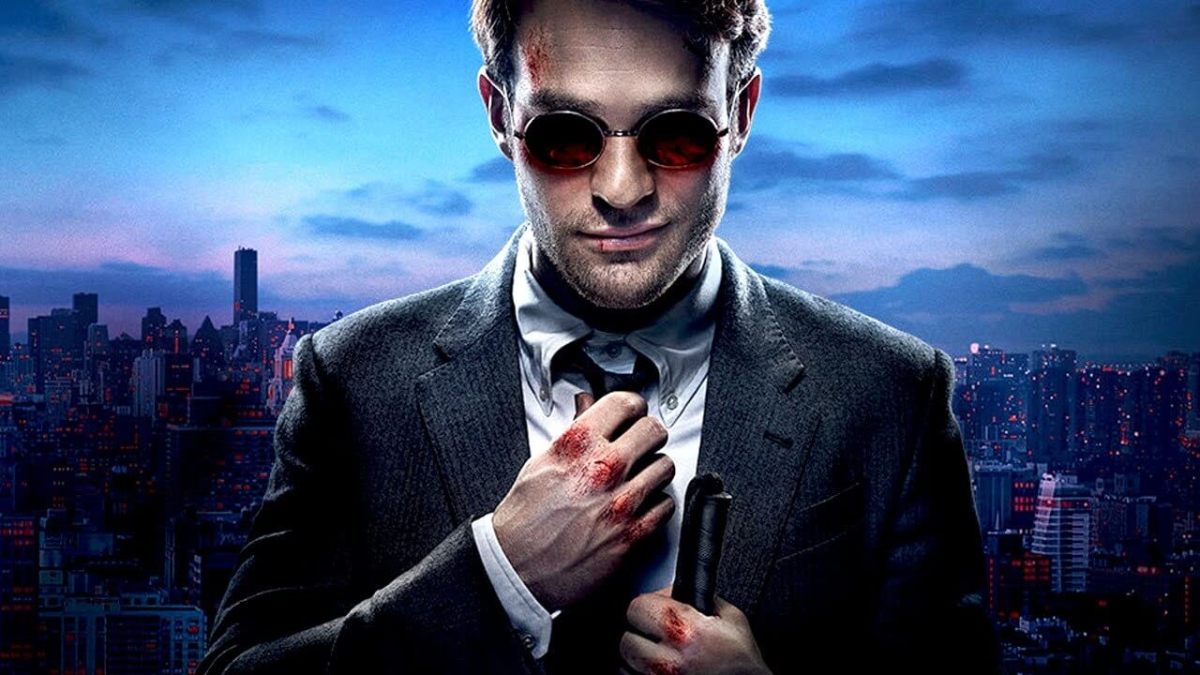 Matt Murdock smirks and adjusts his tie, his knuckles covered in blood.