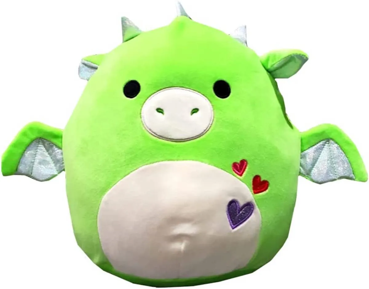 A bright green dragon Squishmallow with hearts embroidered on his stomach