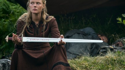 Fredyis sits in the wood holding her sword in 'Vikings: Valhalla.'
