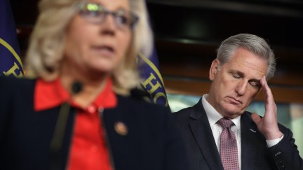 Kevin McCarthy puts his hand to his temple and closes his eyes, looking distressed.