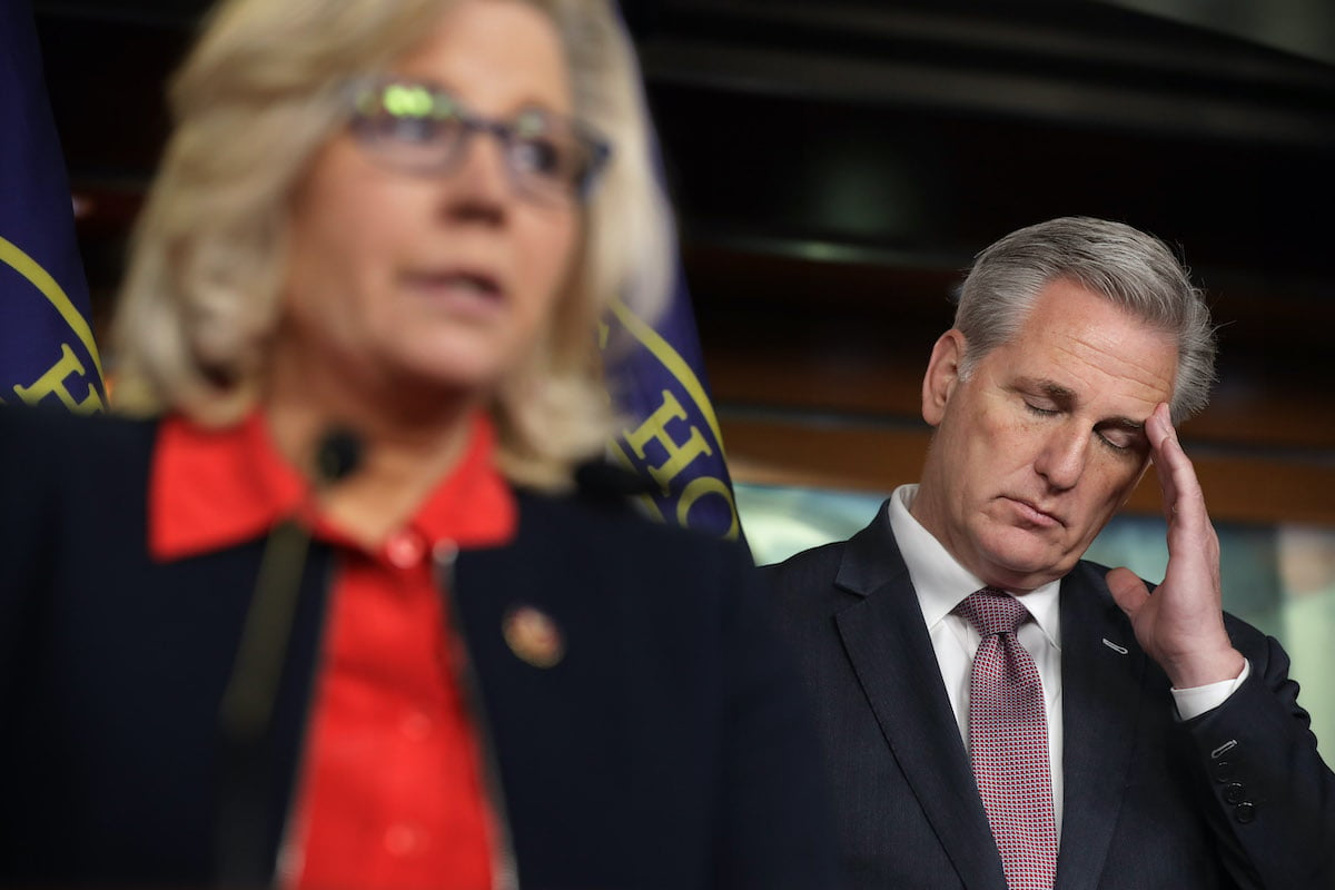 Kevin McCarthy puts his hand to his temple and closes his eyes, looking distressed.