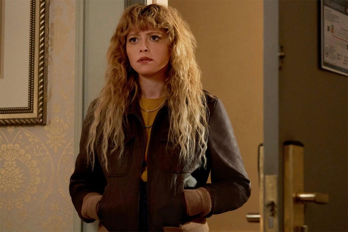 Natasha Lyonne with her hands in her pockets in Poker Face
