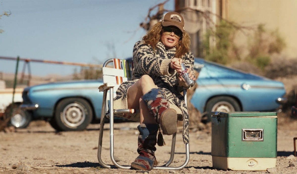 Natasha Lyonne as Charlie Cale sitting outside her home in 'Poker Face'
