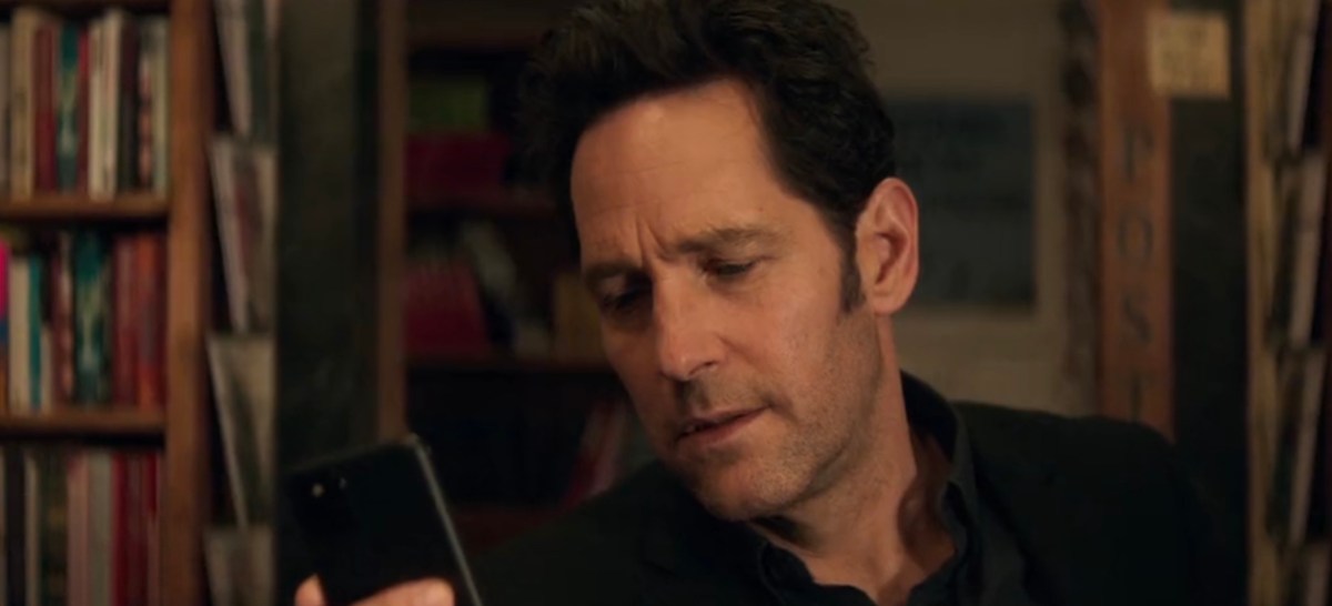 Scott Lang looking at his cell phone.