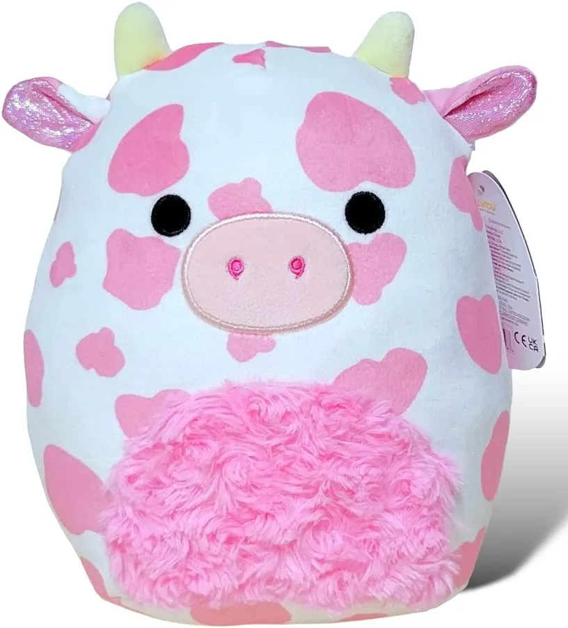 Pink and white cow Squishmallow with a fluffy pink tummy