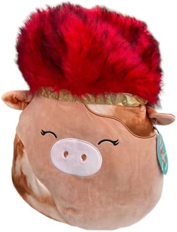 A brown cow Squishmallow with a red punk up do