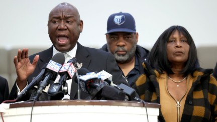 Flanked by Rodney Wells (C) and RowVaughn Wells, the stepfather and mother of Tyre Nichols, civil rights attorney Ben Crump speaks during a press conference on January 27, 2023 in Memphis, Tennessee.