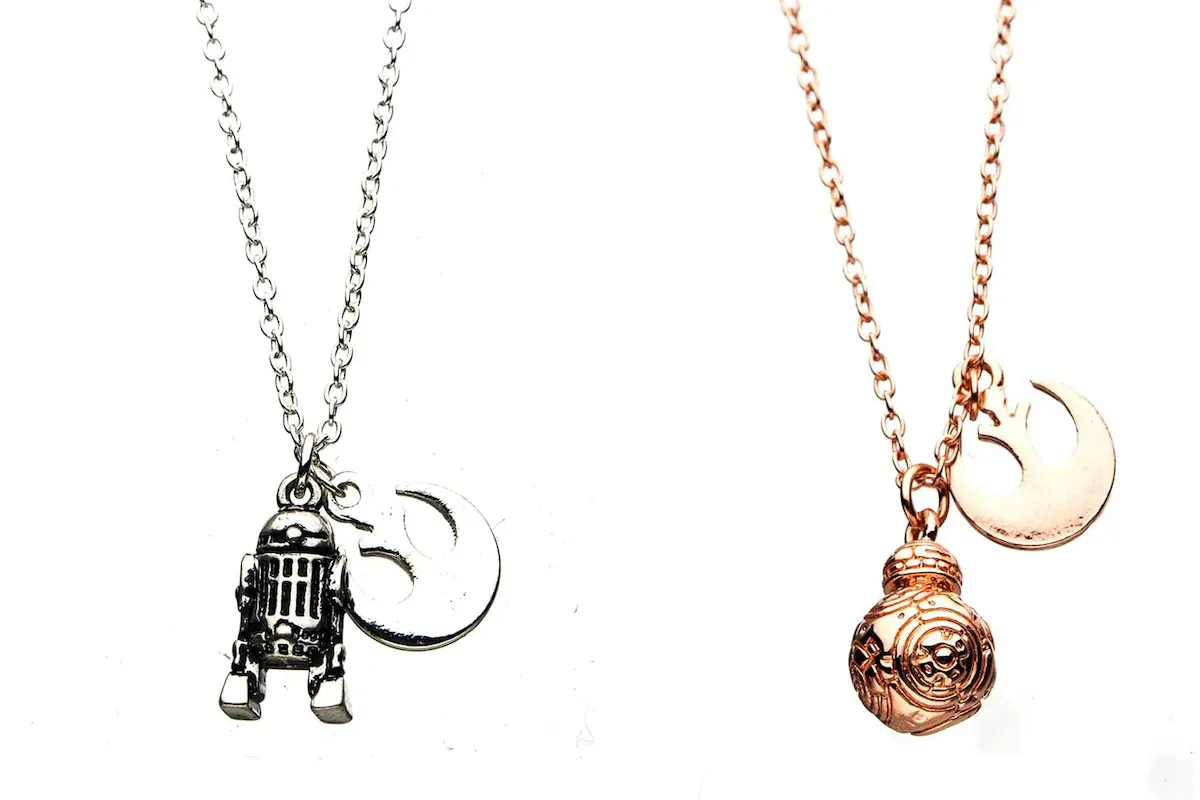 A silver R2D2 and a gold BB8 on chains