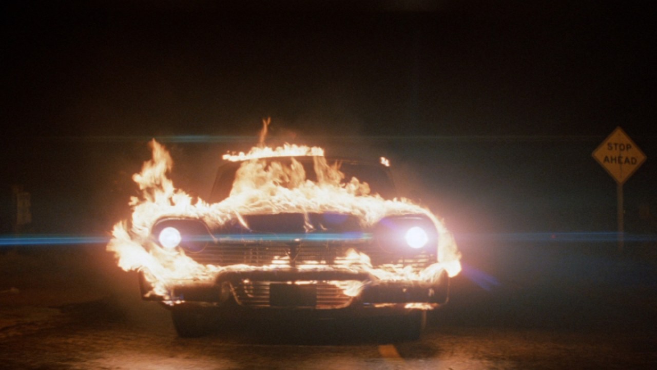 The eponymous car in 'Christine' - a red Plymouth Fury engulfed in flames