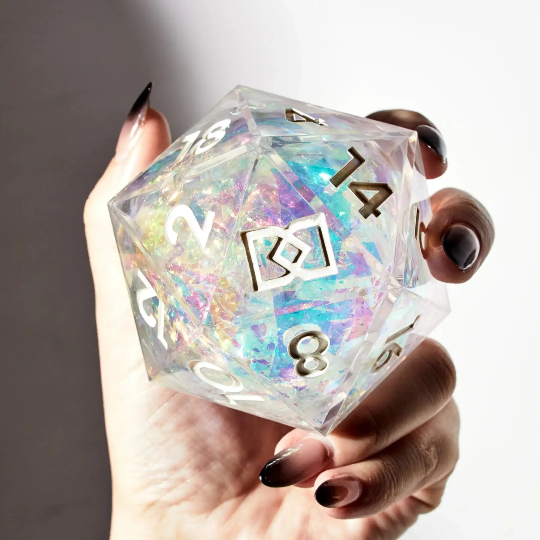 A giant iridescent silver D20