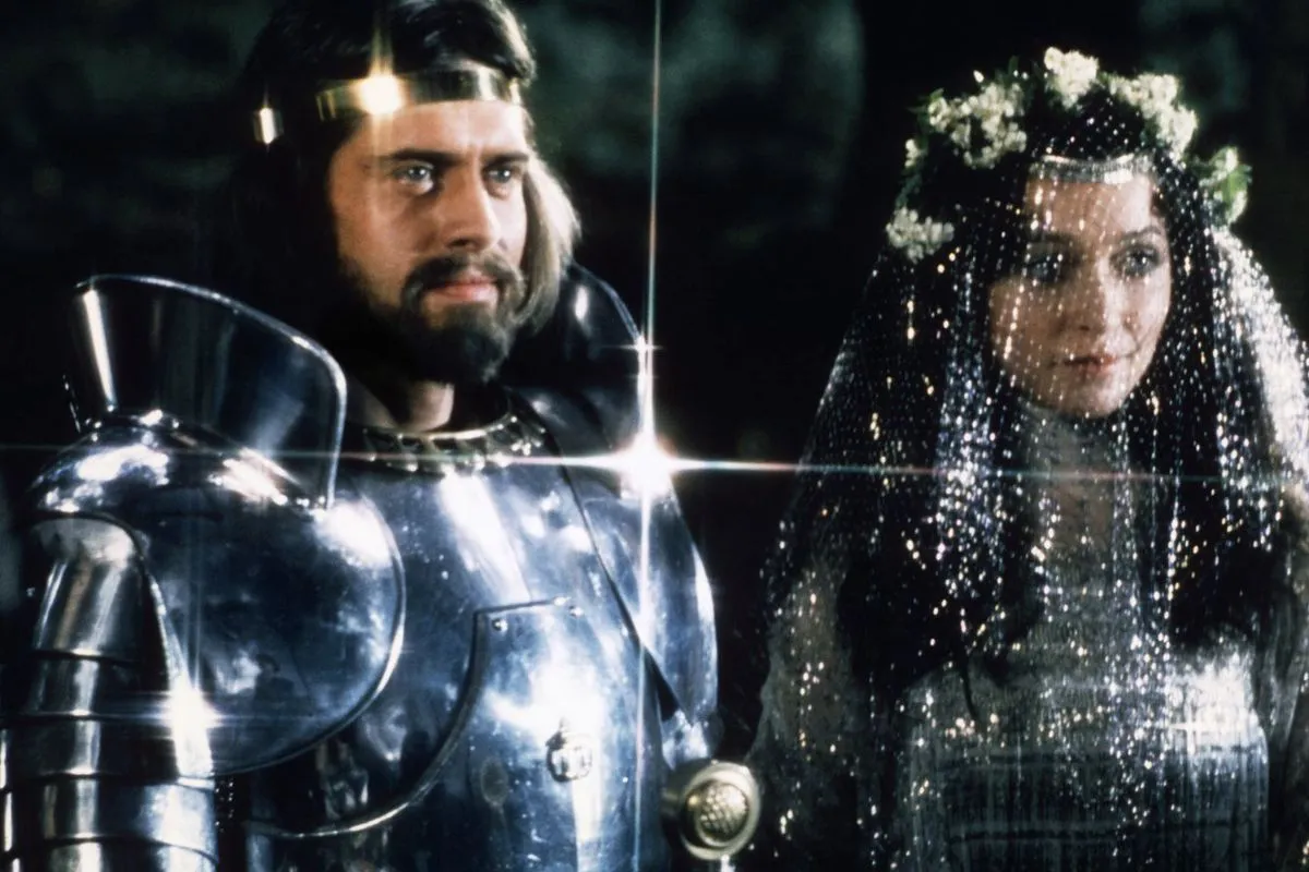 Nigel Terry wearing shining armor as King Arthur and Cherie Lunghi wearing a sparkling veil as Guenevere in Excalibur