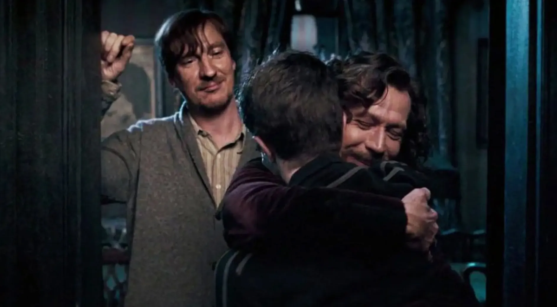 Harry Potter hugs Sirius Black and Remus Lupin in Harry Potter and Order of the Phoenix