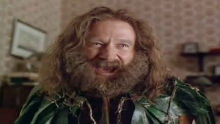 Robin Williams in Jumanji, wearing leaves and a big beard. A still from the 