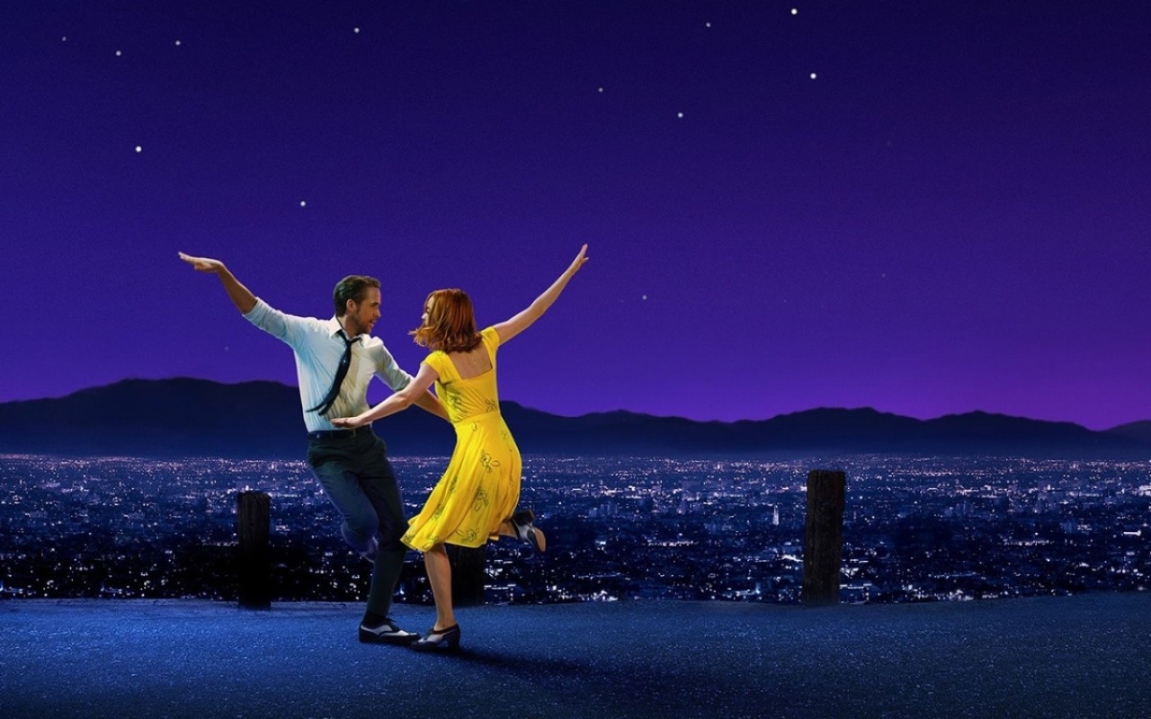 Ryan Gosling and Emma Stone dance together, with a purple sky background, from the movie La La Land.