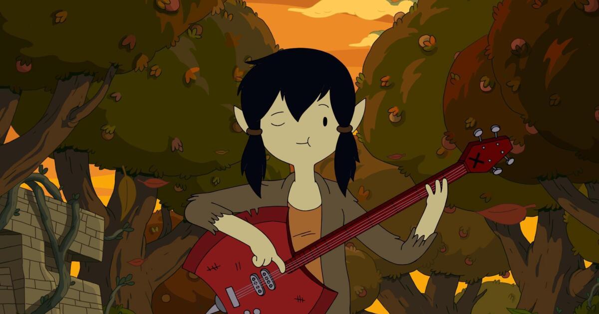 Miss Marceline playing her Battleaxe Bass in an orchard.