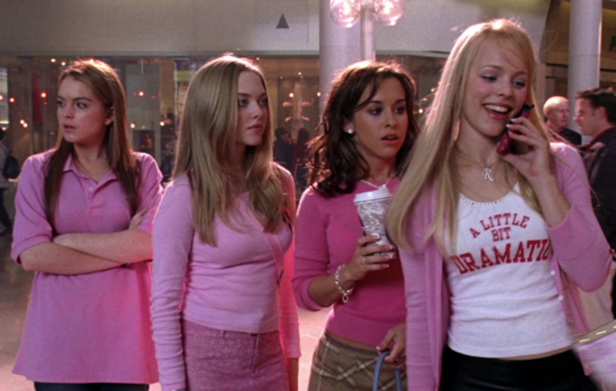 Cady, Karen, Gretchen, and Regina wear pink while standing in the mall