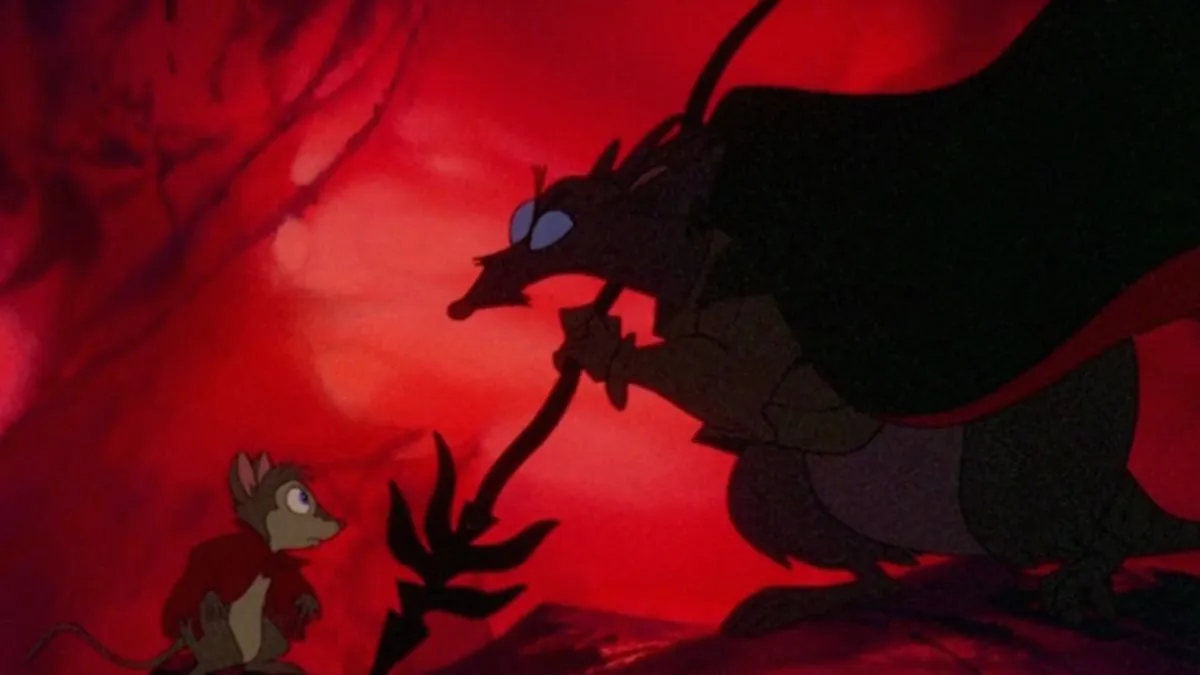 A still from the animated film The Secret of NIMH that depicts a rat with glowing eyes looming over a mouse