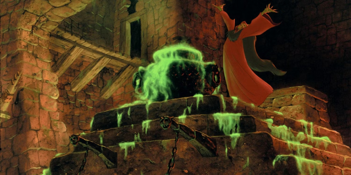A still from the animated film The Black Cauldron depicting a sorcerer in a robe standing over a black iron cauldron full of neon green liquid