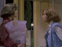 Animated gif from Back to the Future Part II. Young and old Jennifer see each other, scream "I'm young!" and "I'm old!" and pass out. Doc catches young Jennifer.
