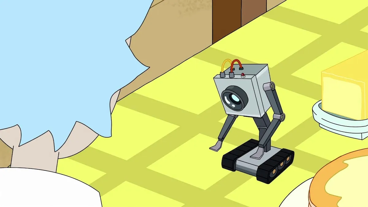 The butter robot in Rick and Morty looks down at its hands.