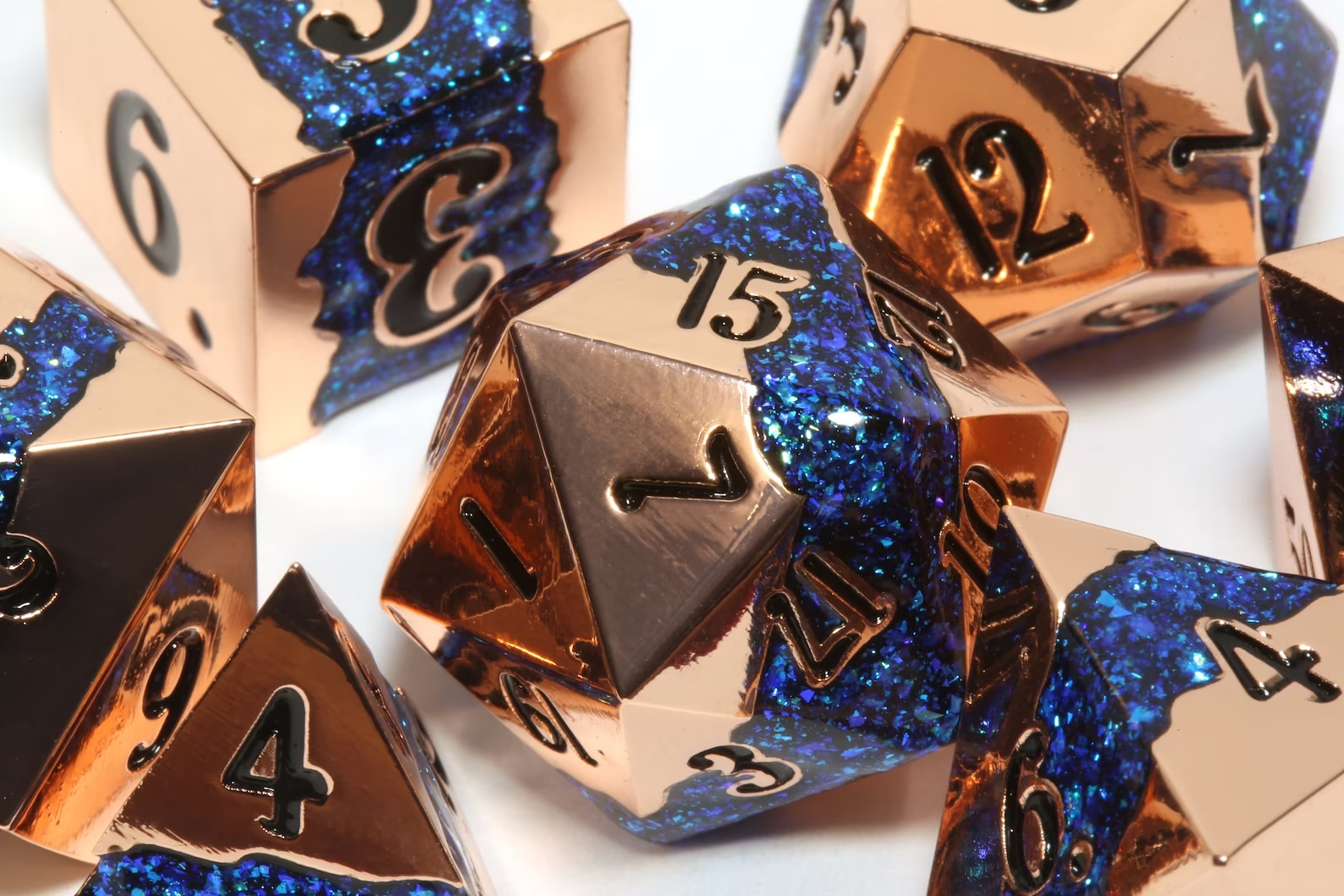 Dice made from copper with veins of sparkly blue resin