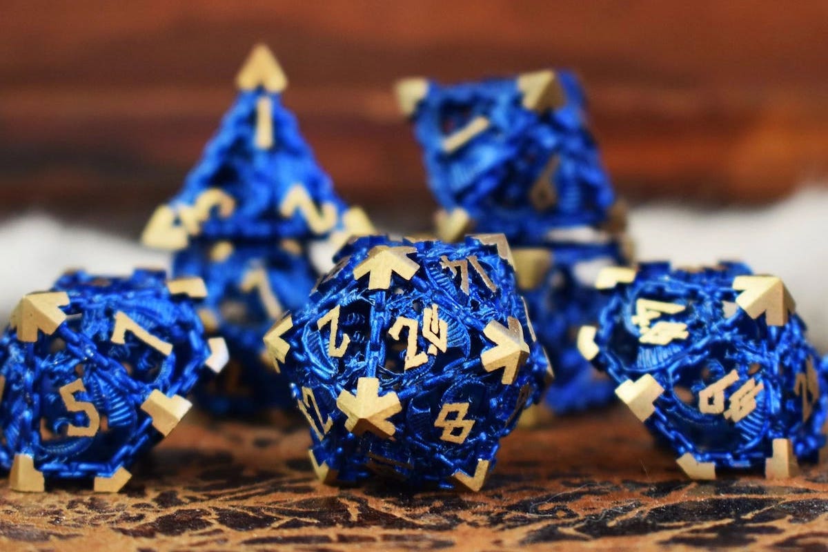 Blue metallic filigree dice with gold detailing