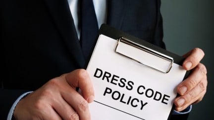 Manager is holding Dress code policy.